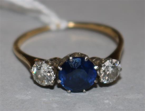 A sapphire and diamond three-stone ring, 18ct yellow gold claw setting